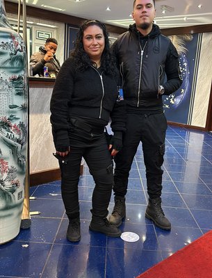 two security guards standing next to each other